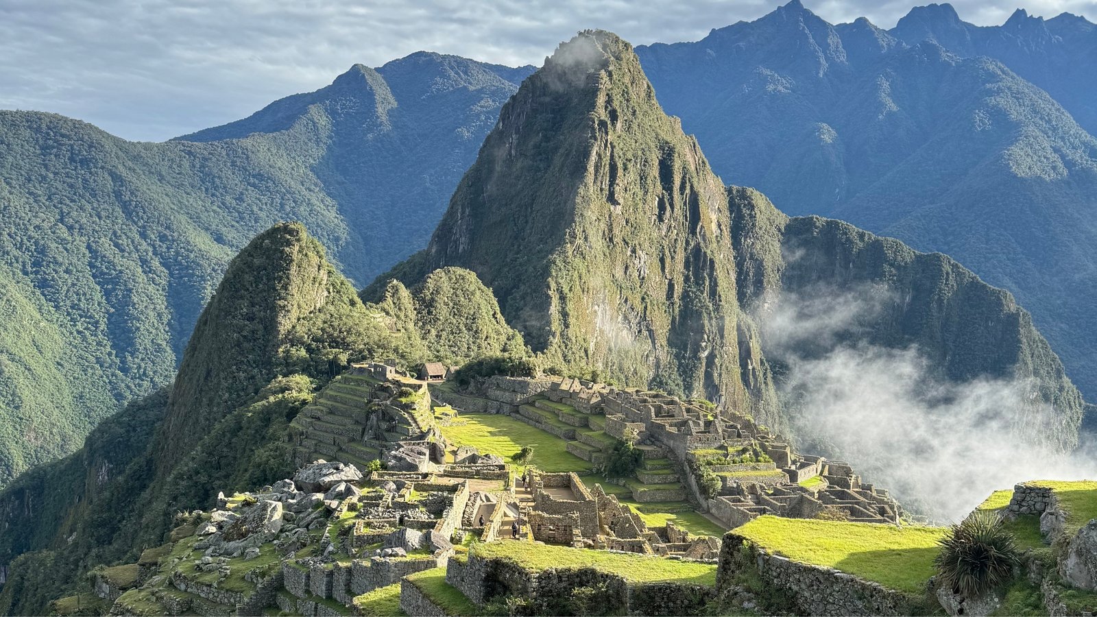 private-experiences-machu-picchu-historical-sanctuary-peru The stunning Machu Picchu Historical Sanctuary glowing under the sunrise, a global icon in Cusco inviting travelers to explore living history through an exclusive, private expedition.